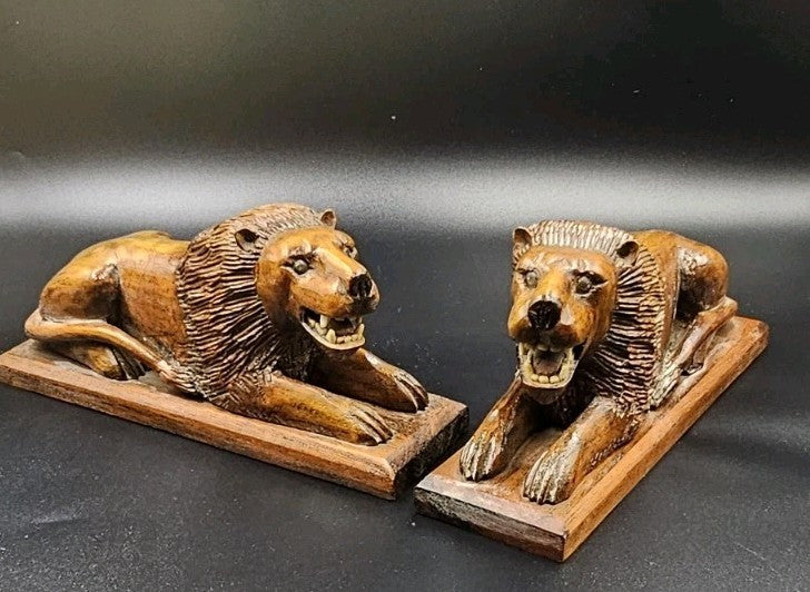 An Antique Pair of Treen Recumbent Lions Hand Carved