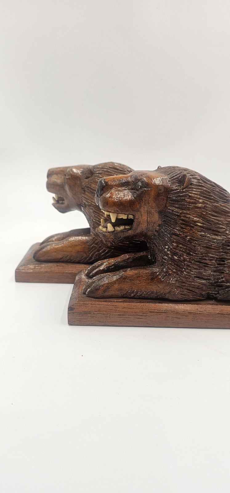 An Antique Pair of Treen Recumbent Lions Hand Carved
