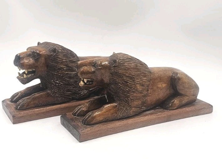 An Antique Pair of Treen Recumbent Lions Hand Carved
