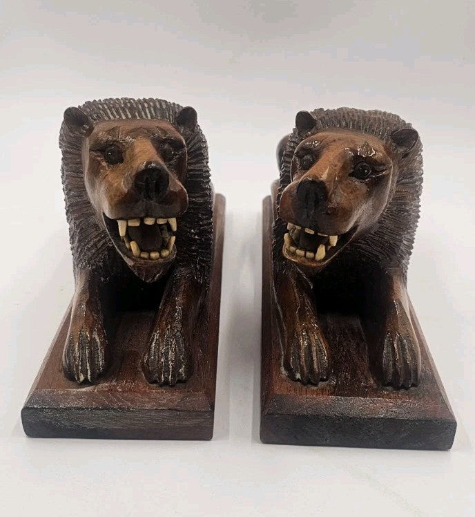 An Antique Pair of Treen Recumbent Lions Hand Carved