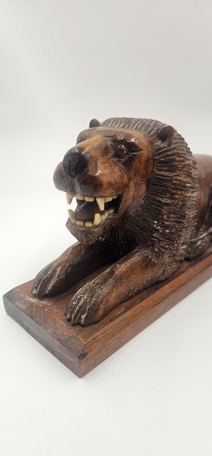 An Antique Pair of Treen Recumbent Lions Hand Carved