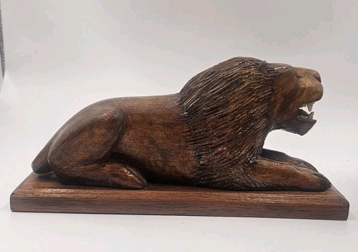 An Antique Pair of Treen Recumbent Lions Hand Carved