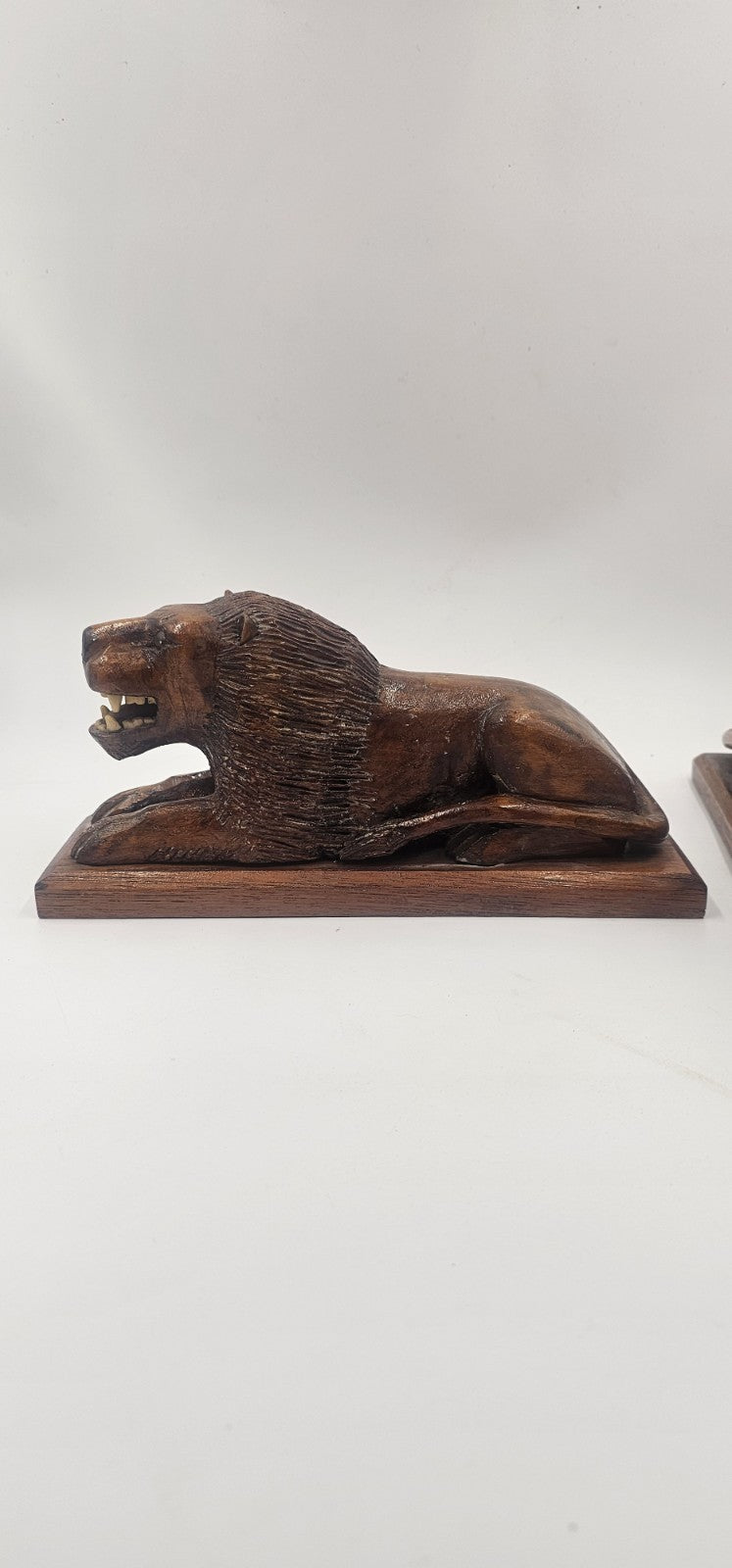 An Antique Pair of Treen Recumbent Lions Hand Carved