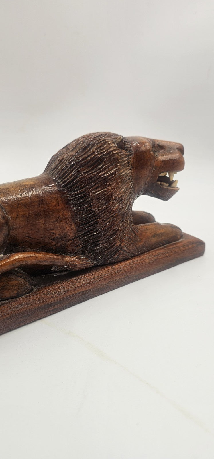 An Antique Pair of Treen Recumbent Lions Hand Carved
