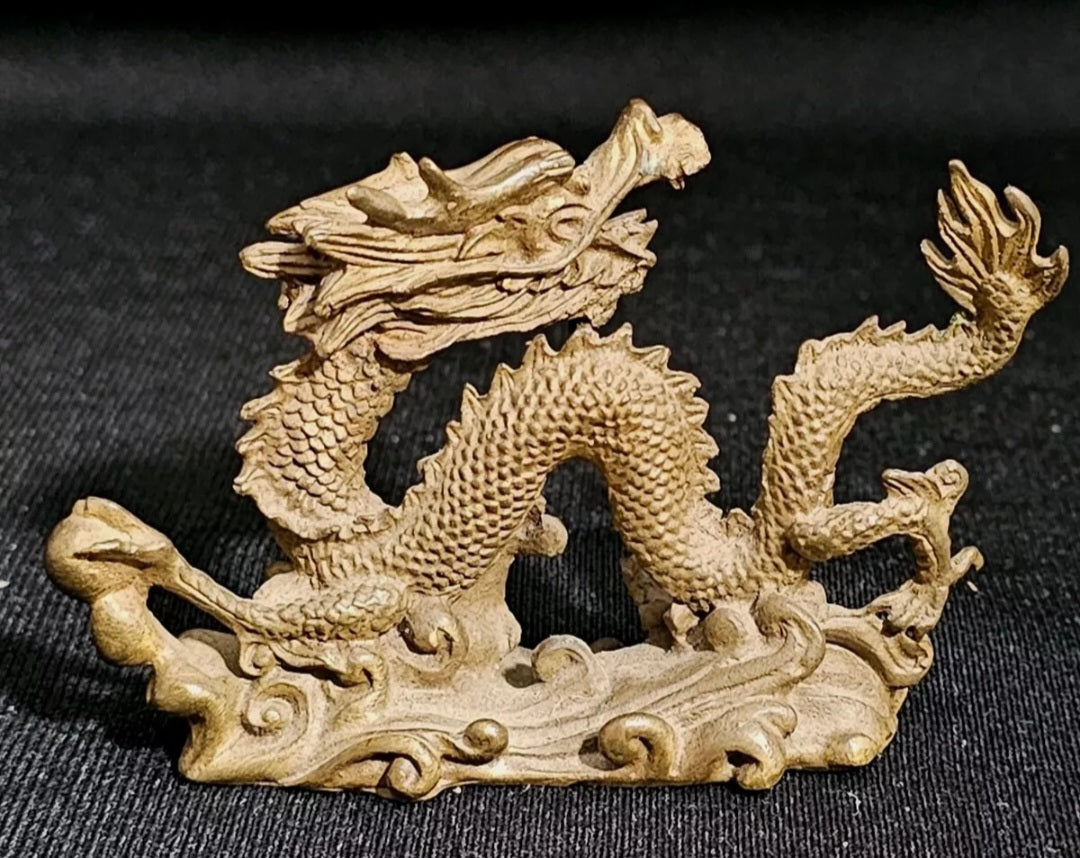 A Chinese Miniature Bronze Sculpture of a Dragon,