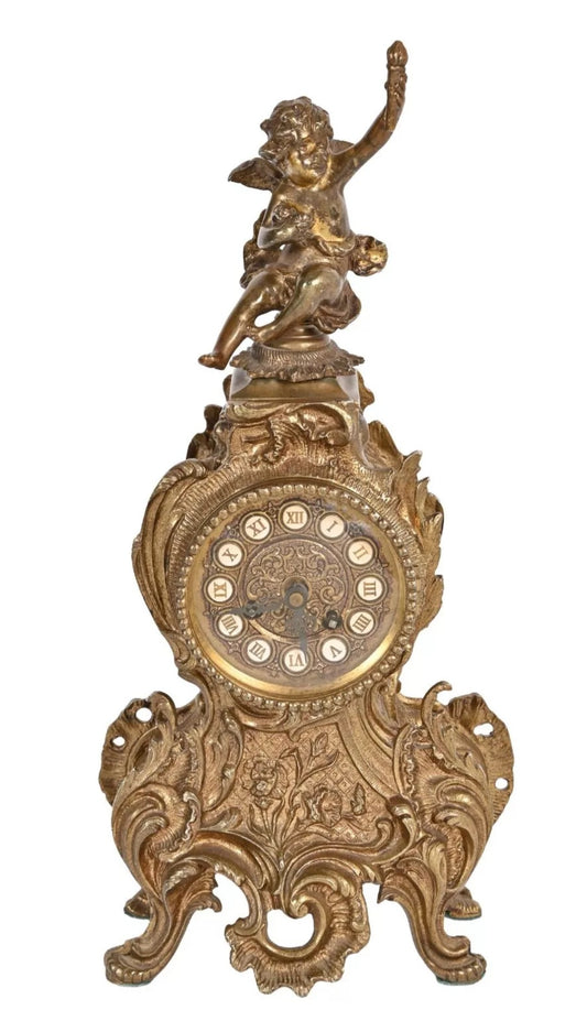 A Louis XV Style Brass Mantle Clock, Mounted with a Cherub, the Dial with Enamel